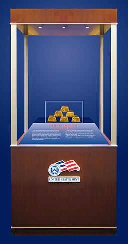 Showcase with the United States Mint Logo which displays six gold bars procured for the production of gold coins from refiners who acquire newly mined gold ore from sources in the United States. This gold must be .9999 grade or higher (24-karat) and fabricated into a standard bar of 400 +/- 50 troy ounces that is marked with the fineness, the melt number and/or bar number for identification and weight, and an approved hallmark.